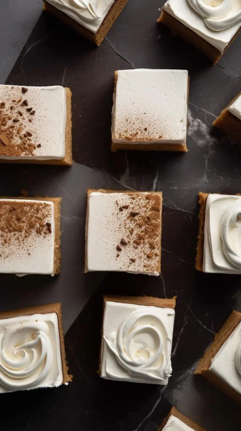Frosted gingerbread brownies topped with creamy frosting and holiday spices