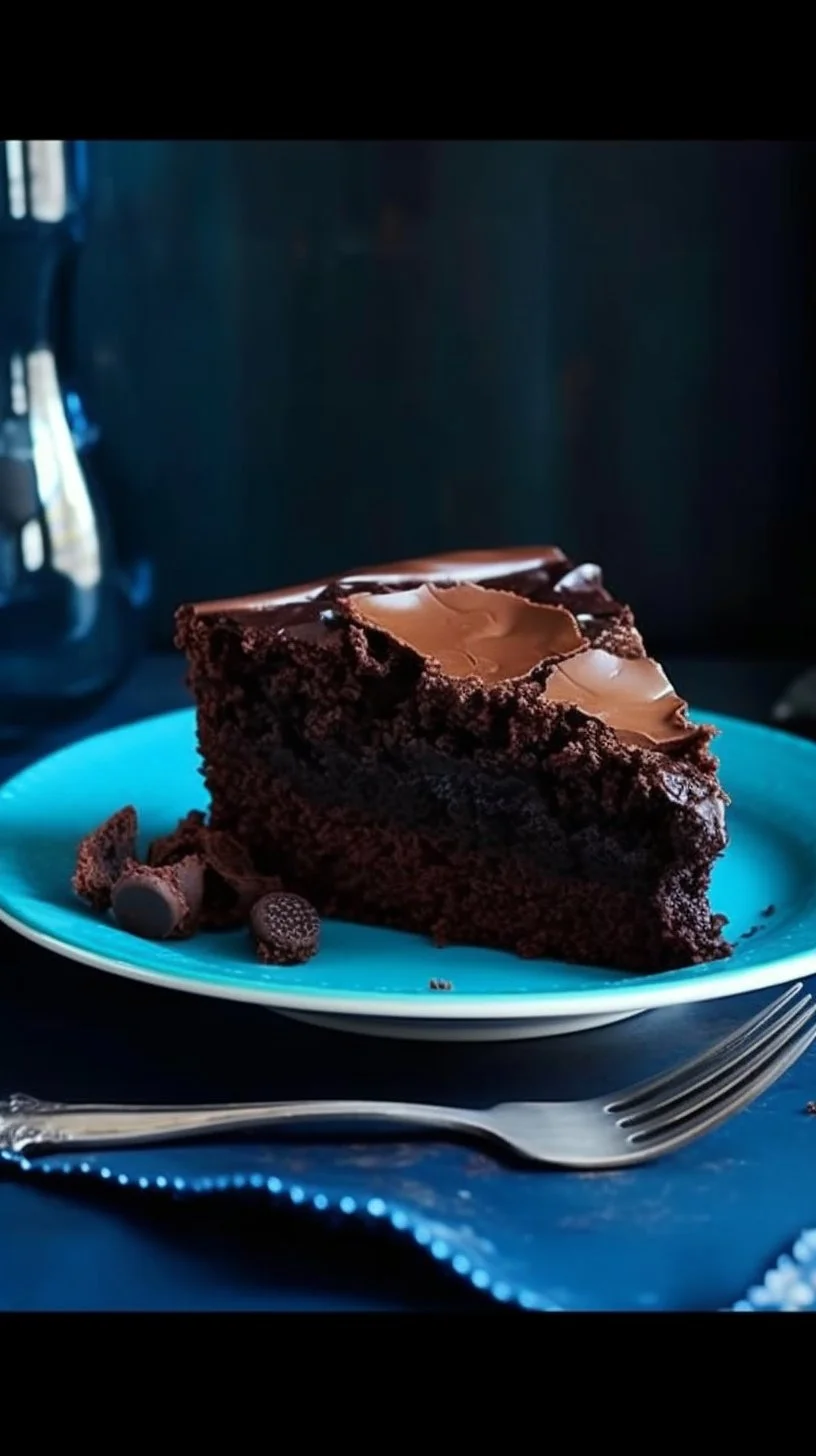 Delicious slice of Chocolate Ooey Gooey Cake topped with chocolate drizzle