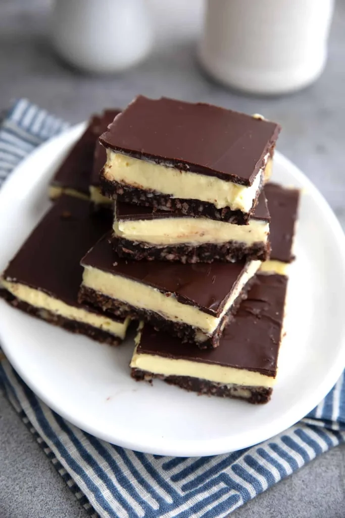 Delicious Keto Nanaimo Bars with layers of chocolate and coconut.