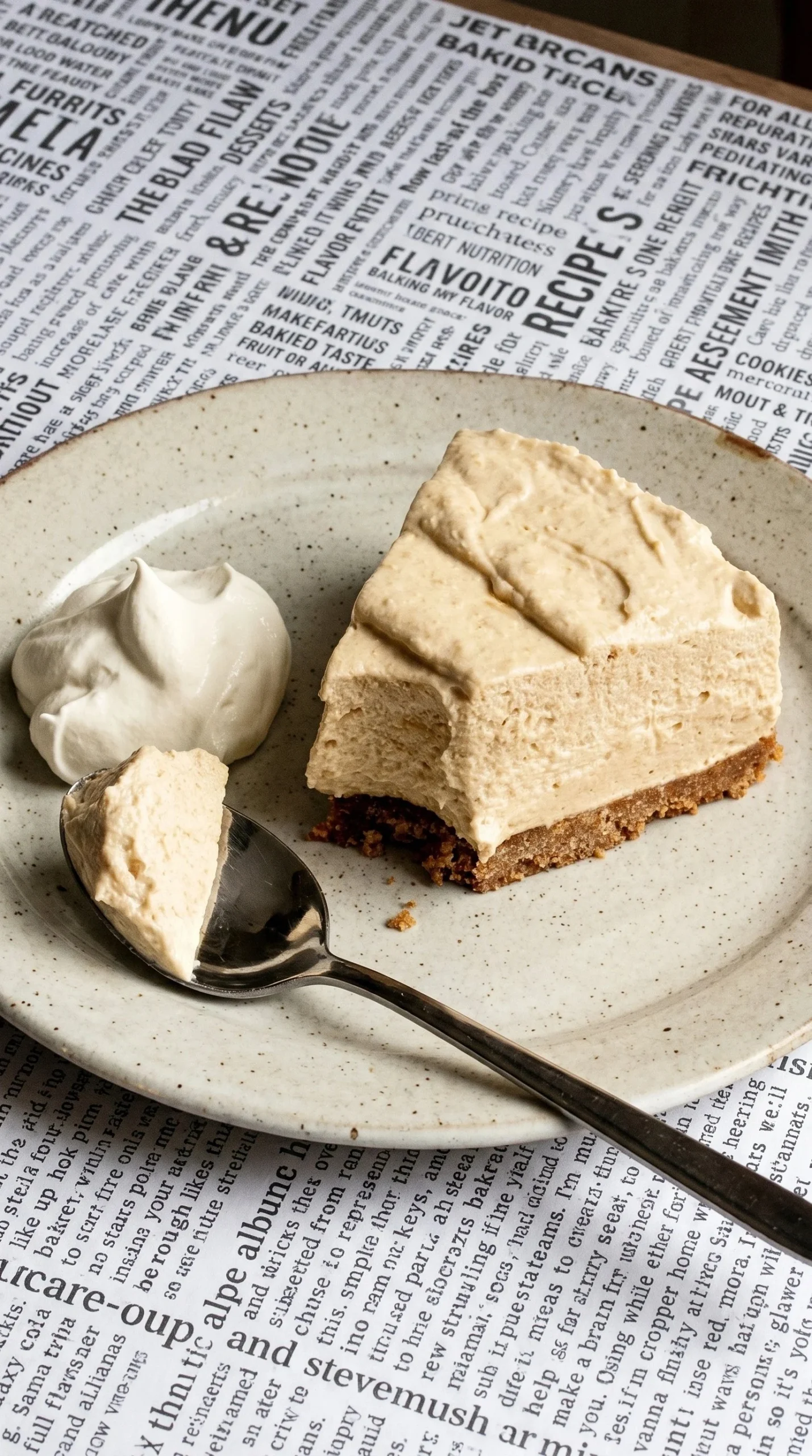 Delicious Caramilk Chocolate Cheesecake topped with caramel drizzle and chocolate shavings.