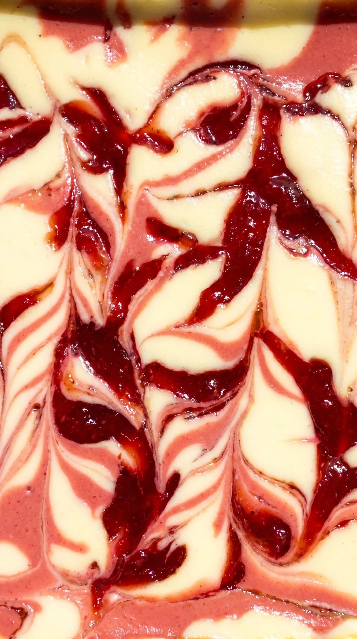 Delicious strawberry cheesecake bars with fresh strawberries on top
